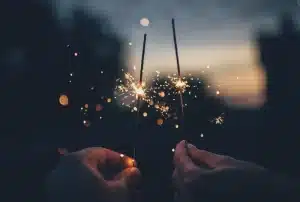 hands holding sparklers celebration of life